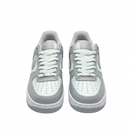 Grey and white Nike sneakers, front view on white background