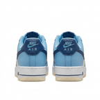 Light blue Nike Air Force 1 sneakers with navy heel tabs, rear view on white background