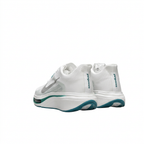Rear view of white Nike sneakers with heel lettering, sculpted white midsoles and teal outsoles on white.