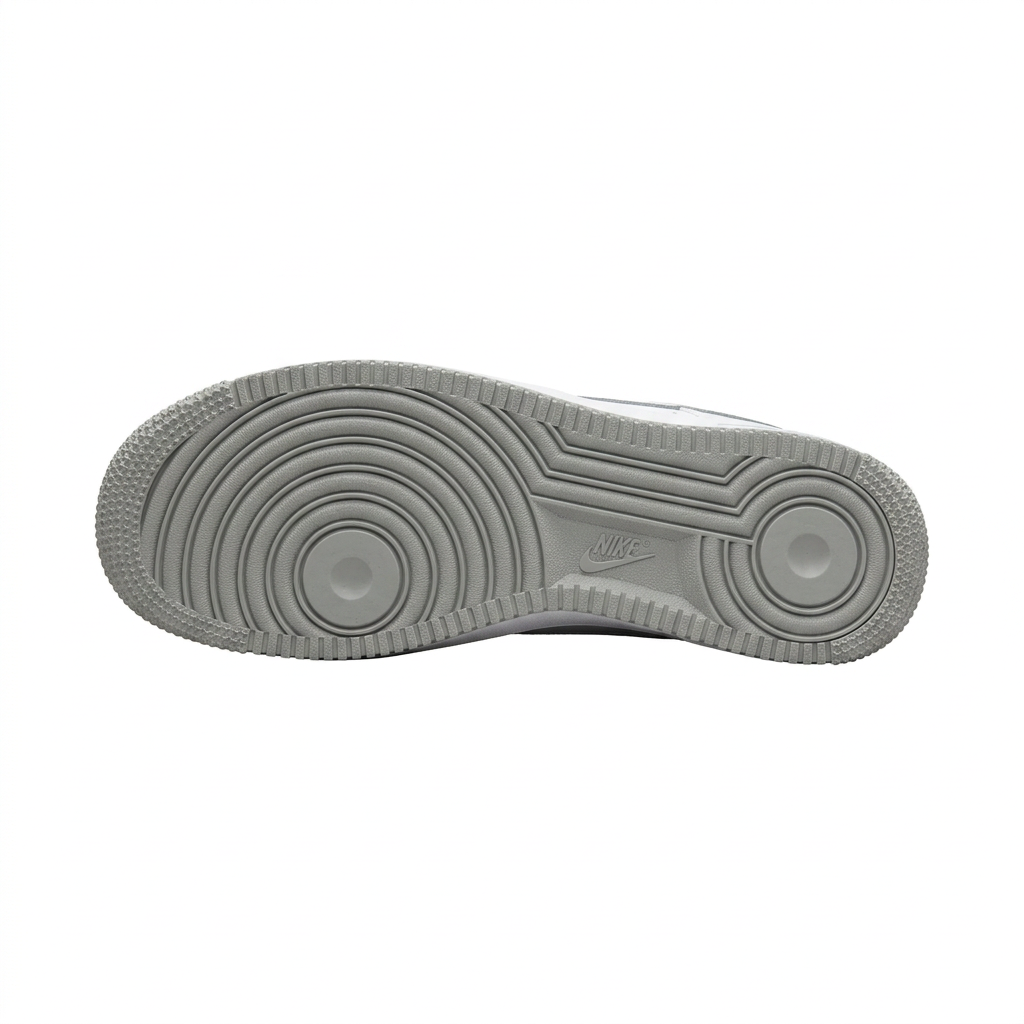 Grey Nike Air Force 1 outsole with circular tread on white background
