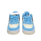 Light blue and cream Nike Air Force 1 sneakers, front view on white background