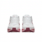 White and rose-pink Nike sneakers, front view on white background