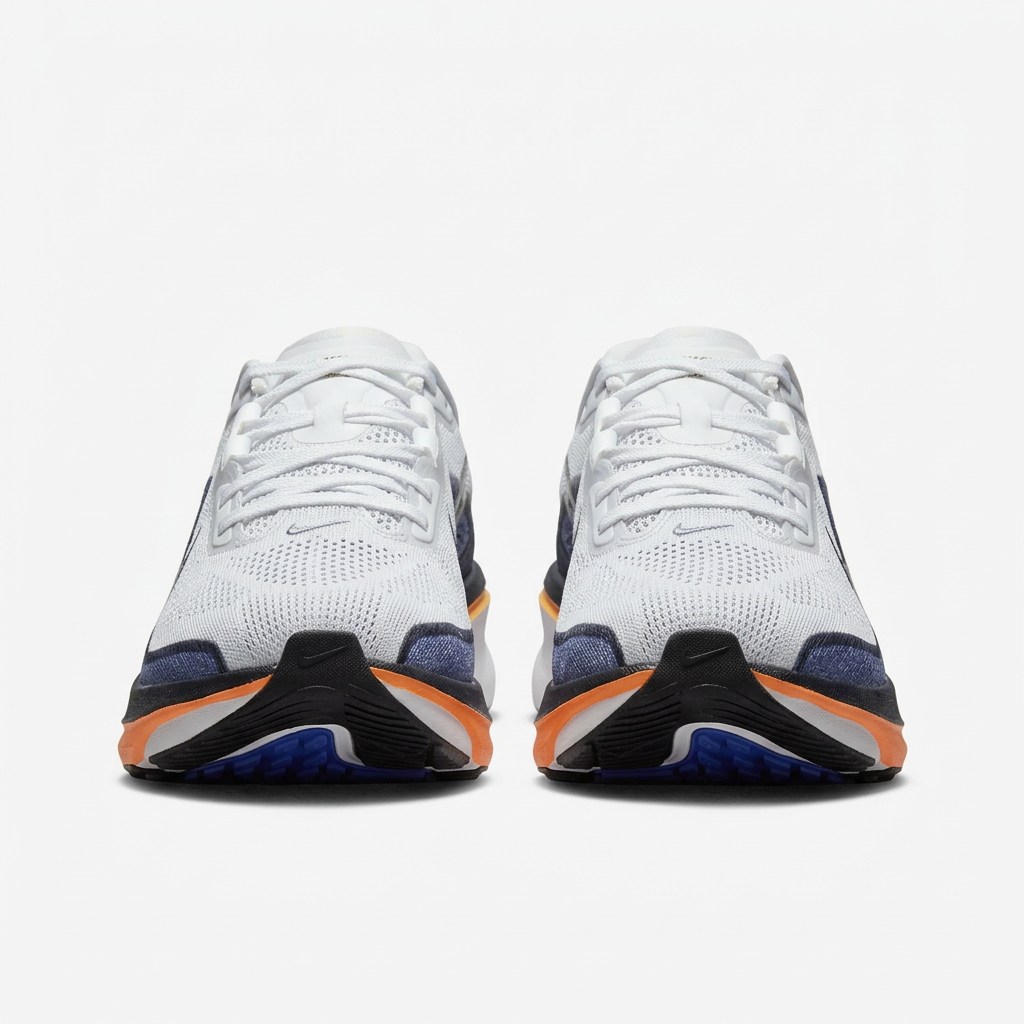 Front view of the white and navy Nike low-top sneakers