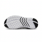 White Nike sneaker outsole with black traction sections on white background