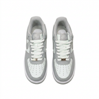 Grey and white Nike sneakers, overhead view on white background