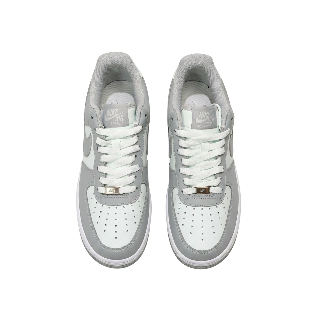 Grey and white Nike sneakers, overhead view on white background
