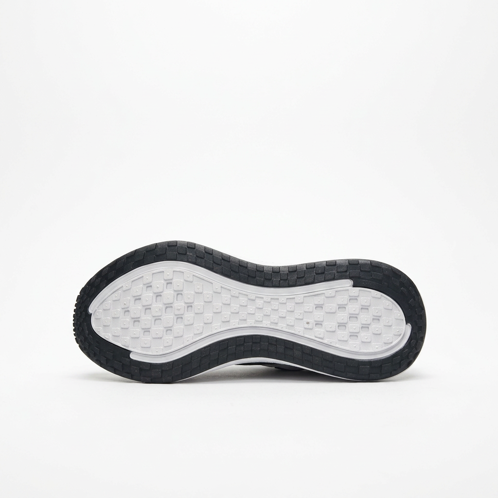 Black outsole of the white Nike ZoomX low-top sneaker
