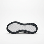 Black outsole of the white Nike ZoomX low-top sneaker