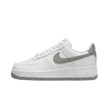 White Nike Air Force 1 sneaker with grey Swoosh and outsole, side view on white background
