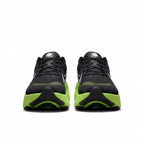 Black and neon-lime Nike sneakers, front view on white background