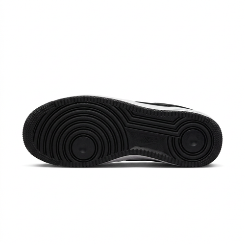 Black Nike Air Force 1 outsole with circular tread on a white background.