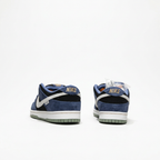 Heel view of the Nike navy blue and black suede low-top sneakers