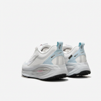 White Nike sneakers with ice-blue heel tabs, rear view on white background