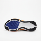 Black outsole with navy tread pod of the white and navy Nike low-top sneaker