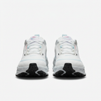 White Nike sneakers with white laces, front view on white background