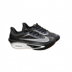Black Nike sneaker pair with sculpted white soles, angled view on white background