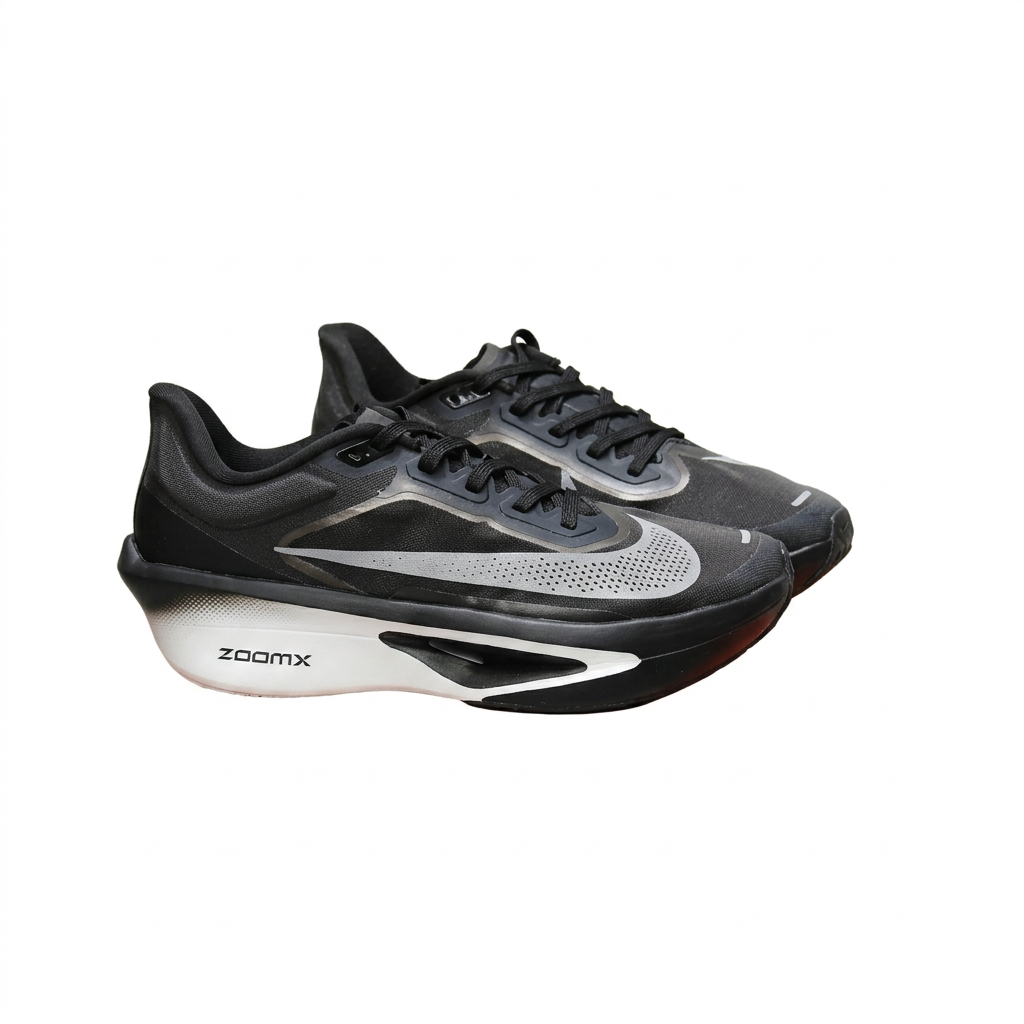 Black Nike sneaker pair with sculpted white soles, angled view on white background