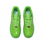 Glossy green Nike Air Force 1 sneakers with matching laces, overhead view on white background