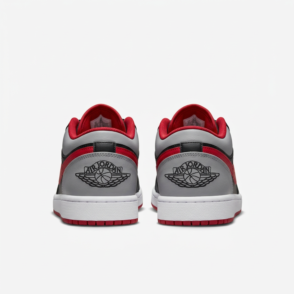 Air Jordan 1 Low sneakers with Wings heel logos, rear view on white background