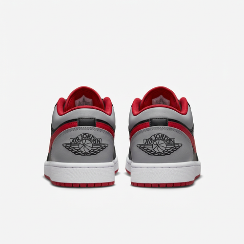 Air Jordan 1 Low sneakers with Wings heel logos, rear view on white background