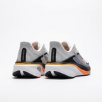 Heel view of the white and navy Nike low-top sneakers