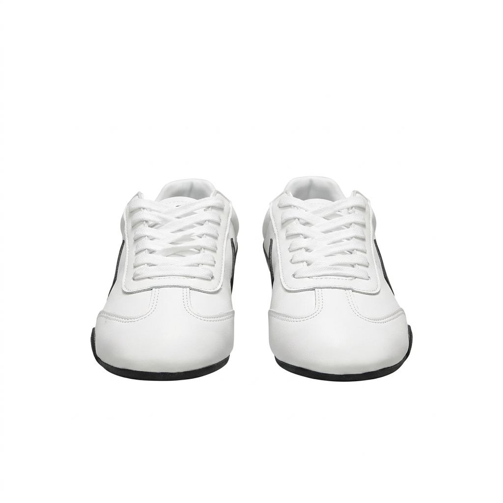 Front view of white Nike low-top sneakers with white laces and black outsole accents on white.