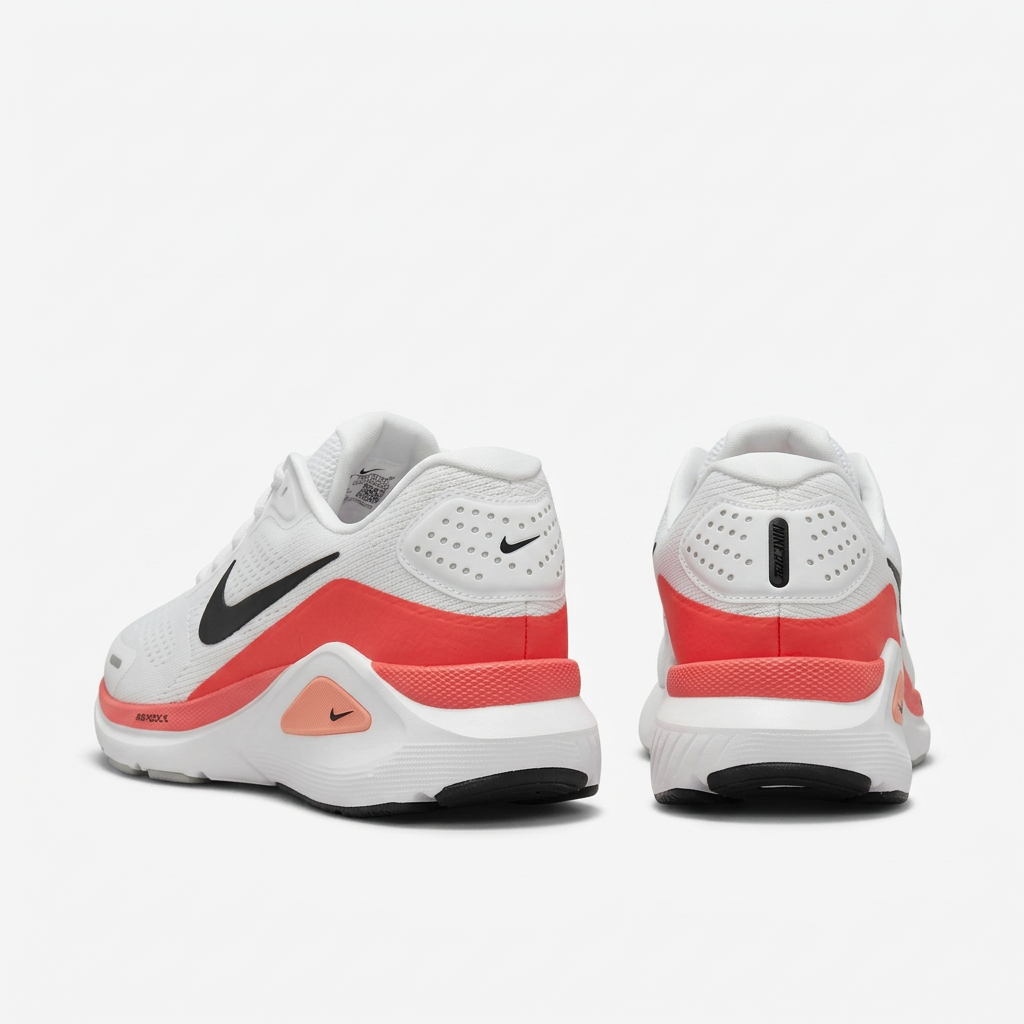 White Nike sneakers with coral-red heel bands, rear view on white