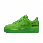 Glossy bright green Nike Air Force 1 sneaker with tonal Swoosh, side view on white background