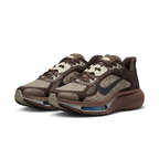 Pair of dark brown and taupe Nike sneakers with charcoal Swoosh and blue forefoot windows on white.