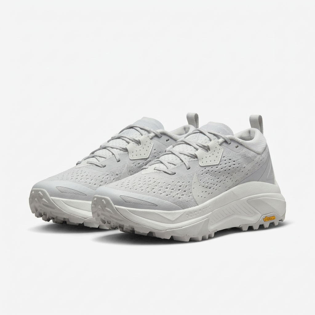 Light grey and white Nike ACG sneakers, angled view on white background