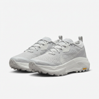 Light grey and white Nike ACG sneakers, angled view on white background