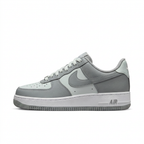 Grey and white Nike sneaker, side view on white background
