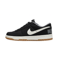 Black Nike sneaker with white Swoosh and gum-colored outsole, side view on white background