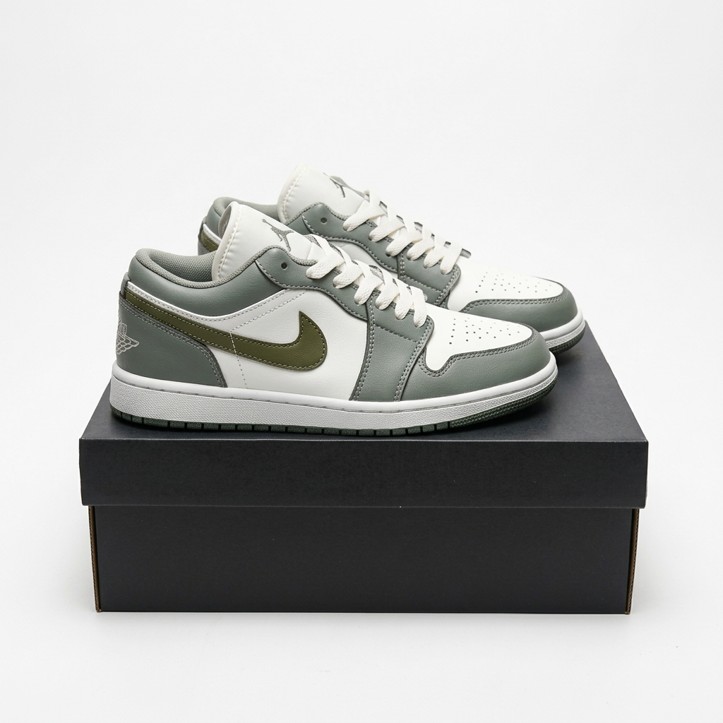 Grey and white Air Jordan 1 Low sneakers on a black shoe box