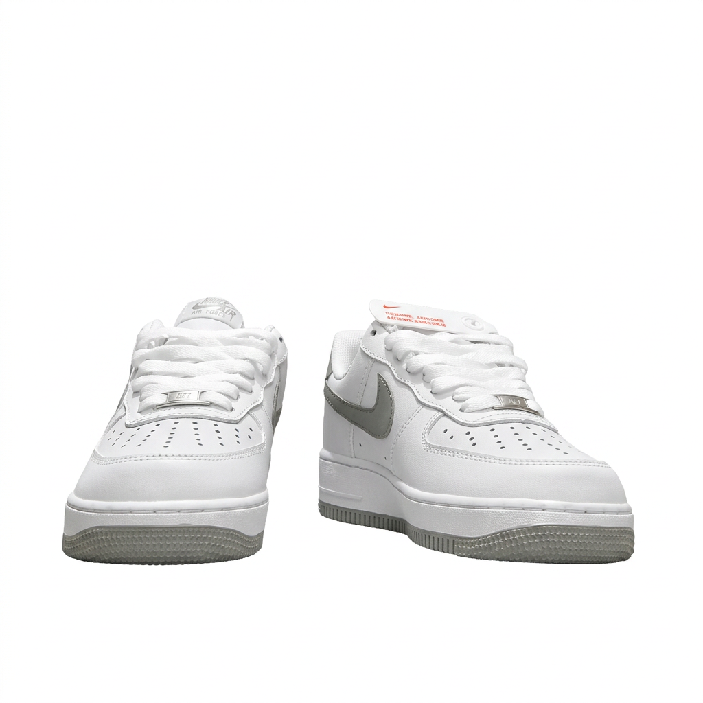 White and grey Nike Air Force 1 sneakers, front view on white background