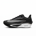Black Nike sneaker with silver Swoosh and white sculpted sole, side view