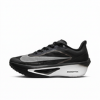 Black Nike sneaker with silver Swoosh and white sculpted sole, side view