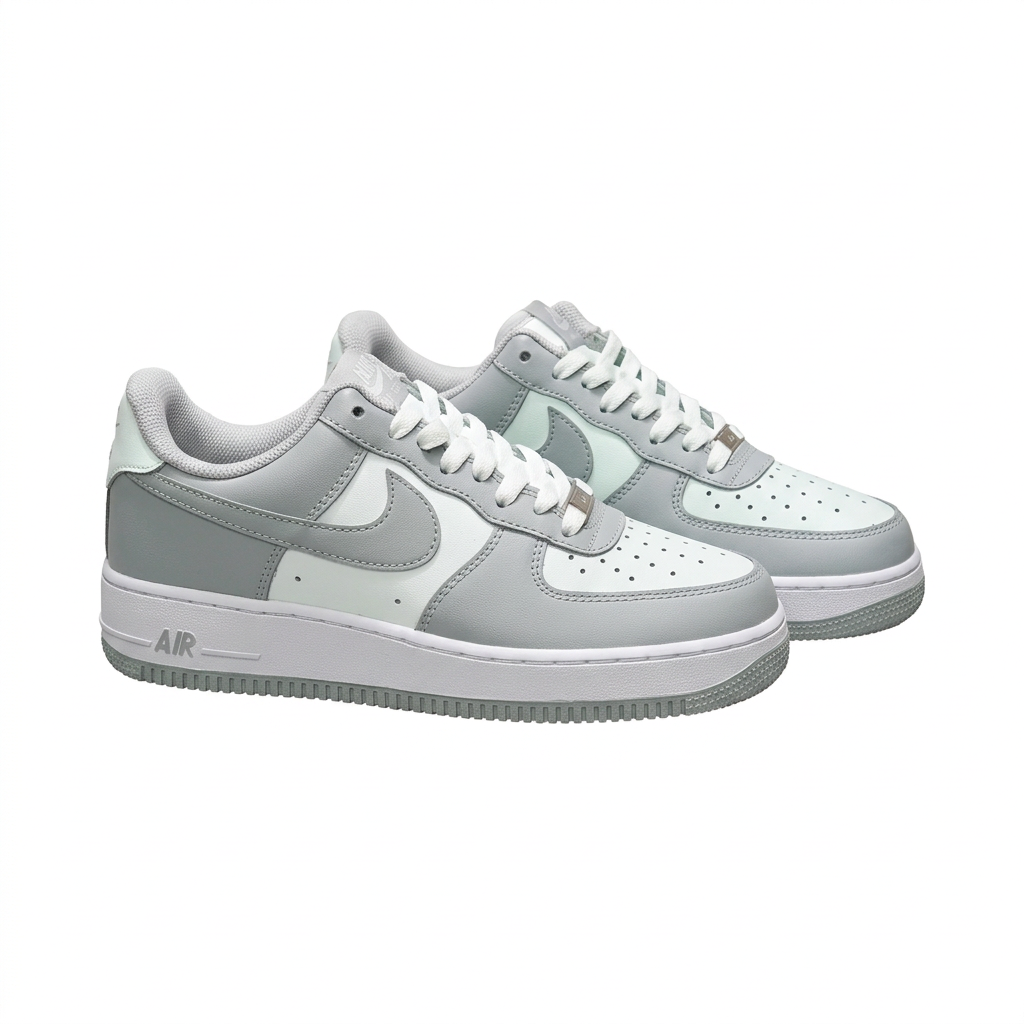 Grey and white Nike sneakers, angled side view on white background