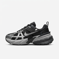 Black and metallic silver Nike chunky sneaker, side view on white background
