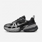 Black and metallic silver Nike chunky sneaker, side view on white background