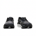 Black Nike sneakers with black laces, front view on white background